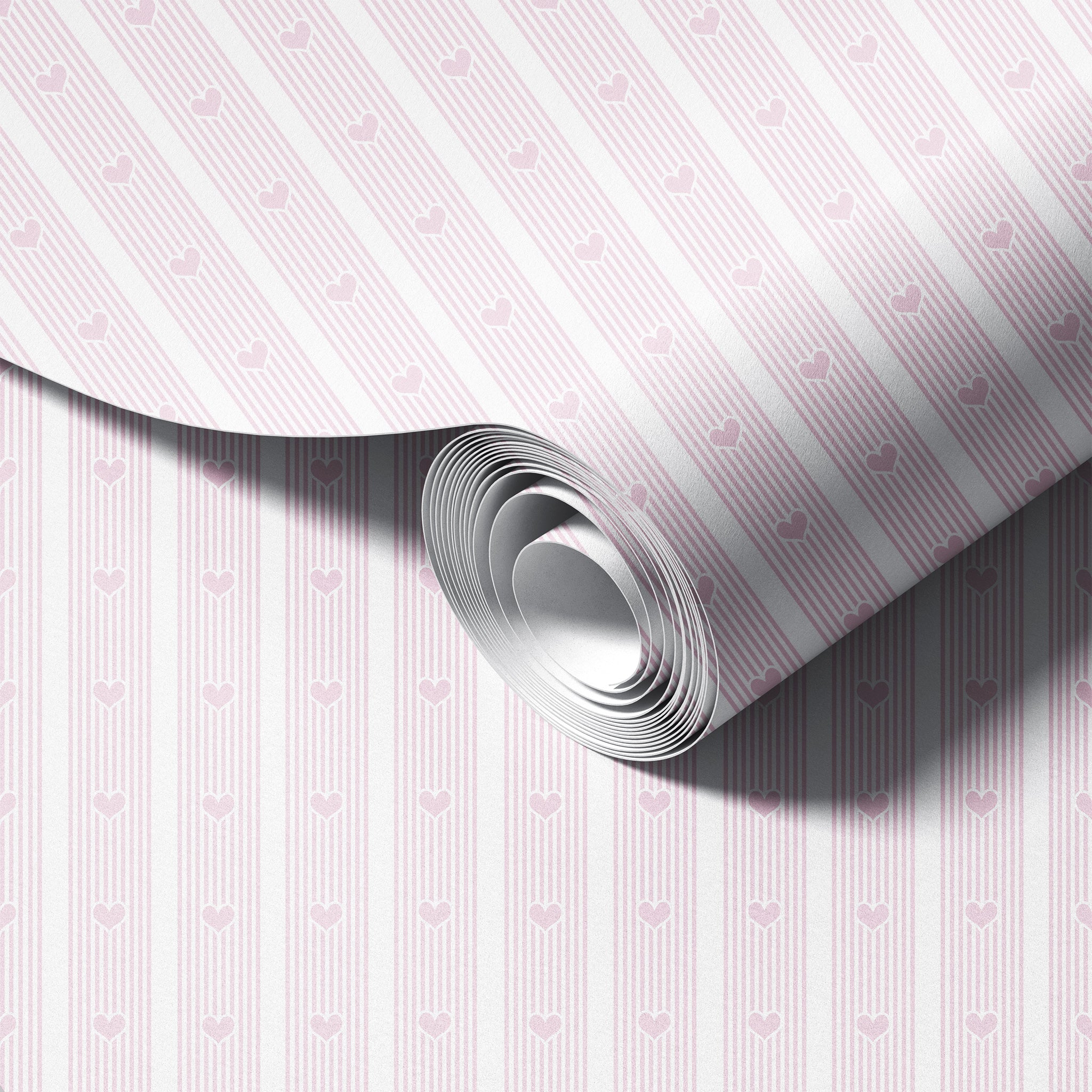 Roll of paper with pink heart pattern on a white background